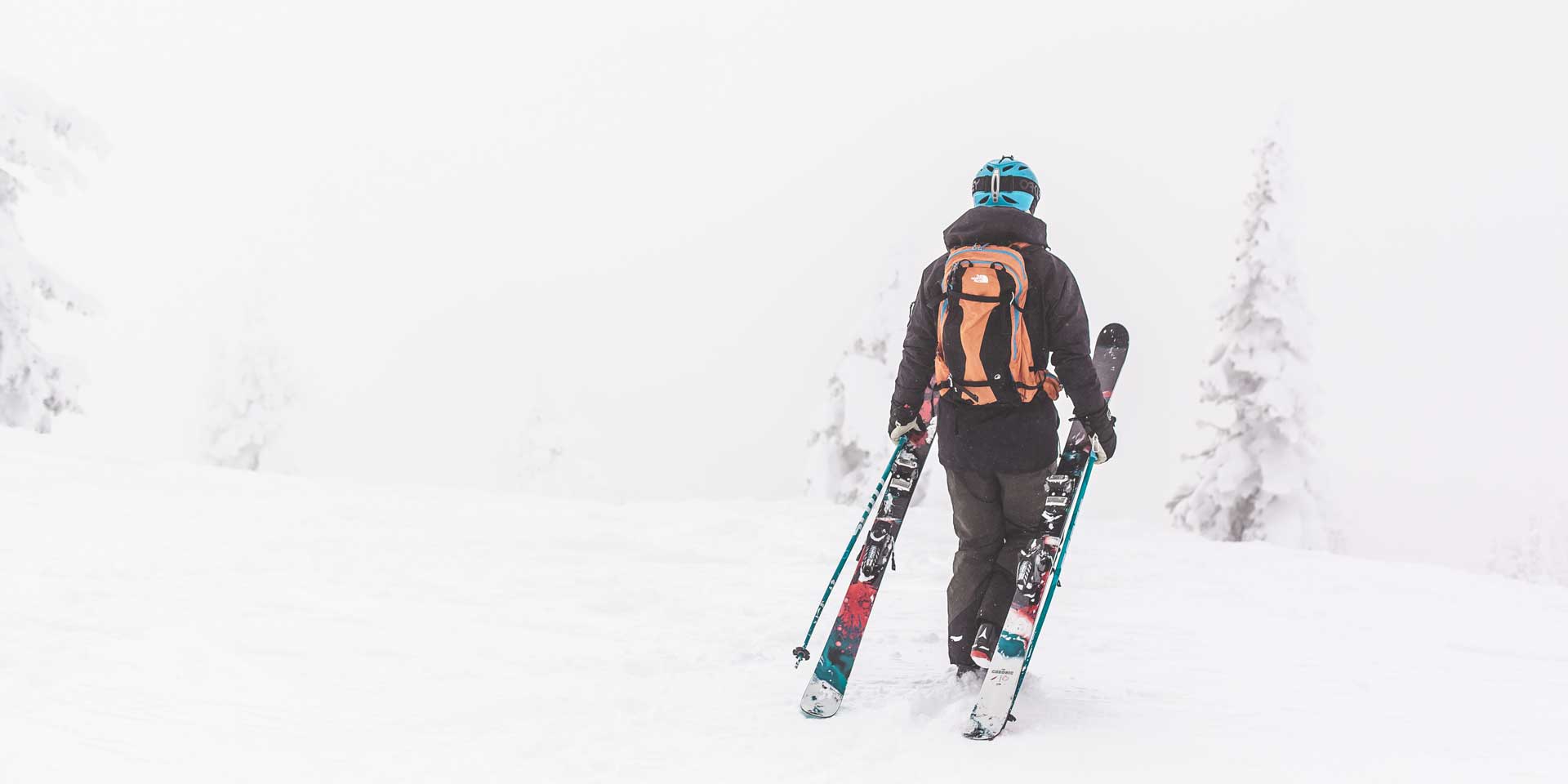 Skier-walking-into-clouds.jpg